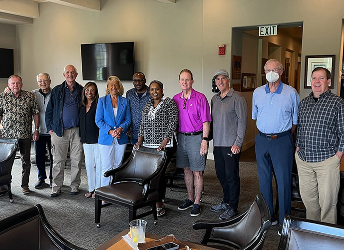 Anastasia meeting with members of Africa New Day, all standing for picture.