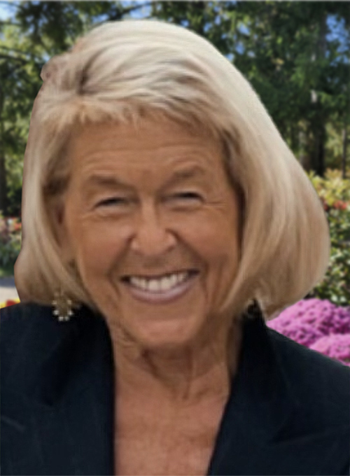 Portrait photo of Anastasia with garden scene behind her in the distance.