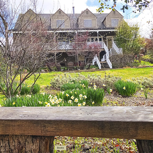 Photo of Julian Project House from a garden bench.