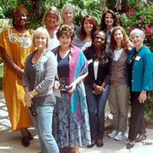 A group of women posing outside during a Listen to My Life session.