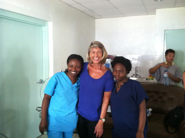 Anastasia standing with friends in a hospital in Goma.