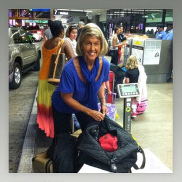 Anastasia at the airport getting ready to check her bags.