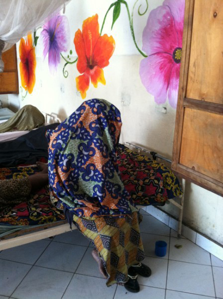 Rape warfgare victim in her newly decorated and cleaned safe area.